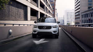 Caption: Sleek Volvo Xc40 In Natural Setting Wallpaper