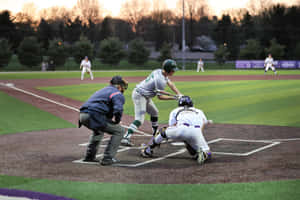 Caption: Spectacular College Baseball Game At Dusk Wallpaper