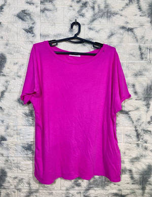 Caption: Striking Magenta Shirt On Hanger Wallpaper