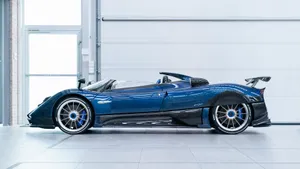 Caption: Striking Pagani Zonda Hp Barchetta In Motion Wallpaper