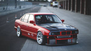 Caption: Striking Red Bmw E34 In Full Hd Wallpaper