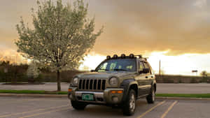 Caption: Stunning Jeep Liberty On Rugged Terrain Wallpaper