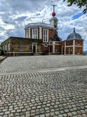 Caption: Stunning Night View Of The Royal Observatory In Greenwich Wallpaper