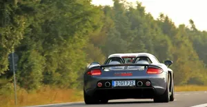 Caption: Stunning Porsche Carrera Gt Ready To Race Wallpaper