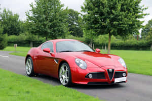 Caption: Stunning Red Alfa Romeo 8c Competizione In Action Wallpaper