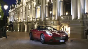 Caption: Stunning Red Ferrari California T In Motion Wallpaper