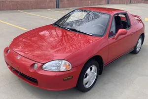 Caption: Stunning Red Honda Civic Del Sol Displaying Superior Aerodynamics Wallpaper