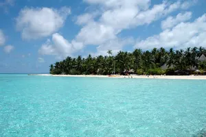 Caption: Stunning Sunset At Maldives Island With Crystal-clear Water And Overwater Villa Wallpaper