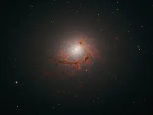 Caption: Stunning View Of A Dazzling Elliptical Galaxy Wallpaper