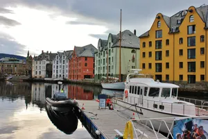 Caption: Stunning View Of Ålesund, Norway At Dawn Wallpaper