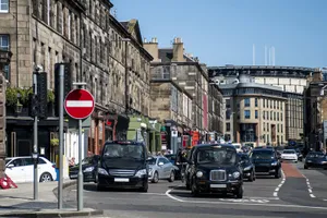 Caption: Stunning View Of Edinburgh Castle At Dusk Wallpaper