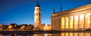 Caption: Stunning View Of Vilnius Cathedral Square At Dusk Wallpaper