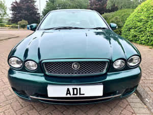 Caption: Stylish Jaguar X-type In Its Natural Habitat Wallpaper