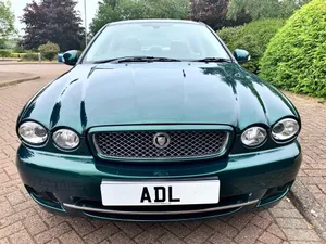 Caption: Stylish Jaguar X-type In Its Natural Habitat Wallpaper