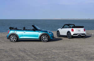 Caption: Stylish Mini Cooper Convertible Cruising Through The City Wallpaper