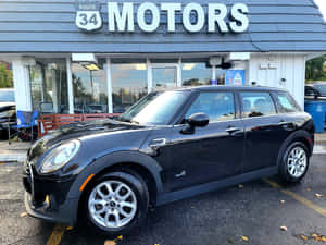 Caption: Stylish Mobility: Mini Cooper S Clubman All4 On The Road Wallpaper