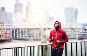 Caption: Stylish Person In A Vibrant Red Hoodie Wallpaper