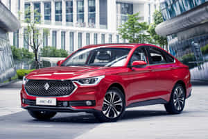 Caption: Stylish Red Baojun Car On City Street Wallpaper