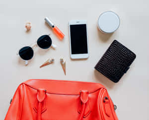 Caption: Stylish Red Handbag On White Background Wallpaper