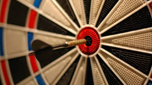 Caption: Successful Shot At Bullseye Target Wallpaper