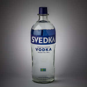 Caption: Svedka Vodka Bottle In A Minimalist Setting Wallpaper