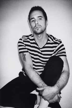 Caption: The Enigmatic Sam Rockwell In Black And White Wallpaper