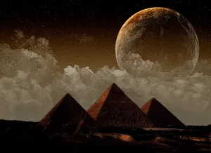 Caption: The Majestic Giza Pyramids Against A Brilliant Sky Wallpaper
