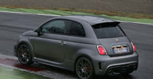 Caption: The Sleek And Sporty Abarth 695 Wallpaper