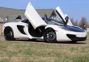 Caption: The Sleek And Sporty Mclaren Mp4-12c Wallpaper