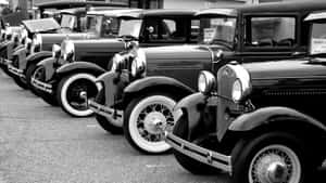 Caption: Timeless Elegance: Black And White Vintage Car Wallpaper