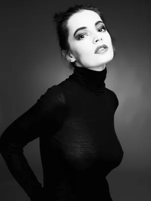 Caption: Timeless Elegance In Black And White Fashion Wallpaper