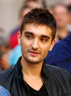 Caption: Tom Parker Striking A Pose Wallpaper