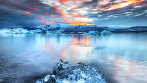 Caption: Tranquil Frozen Lake In Winter Wallpaper