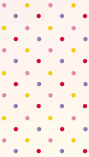 Caption: Vibrant Polka Dot Design On Cream Background Wallpaper