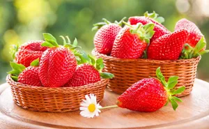 Caption: Vibrant Strawberries In Woven Baskets On A Desktop Wallpaper