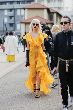 Caption: Vibrant Yellow Fashion Statement Wallpaper