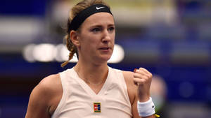 Caption: Victoria Azarenka Celebrating With A Powerful Fist Pump Gesture Wallpaper