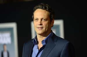 Caption: Vince Vaughn Smiling In A Classic Suit Wallpaper