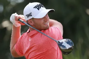 Caption: Wyndham Clark Exuding Confidence On The Golf Field Wallpaper