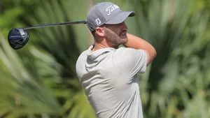 Caption: Wyndham Clark In Action - The Finesse Of Golf Wallpaper