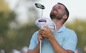 Caption: Wyndham Clark Swinging His Club Professionally Wallpaper
