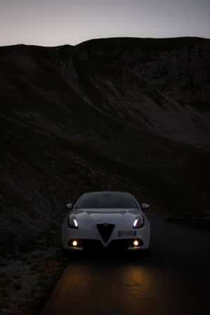 Captivating Alfa Romeo Giulietta In Vibrant Red Wallpaper