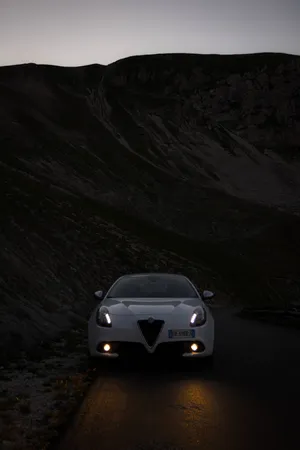 Captivating Alfa Romeo Giulietta In Vibrant Red Wallpaper
