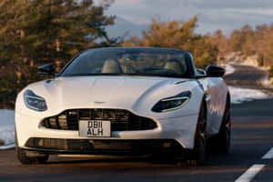 Captivating Aston Martin Db11 In Motion Wallpaper