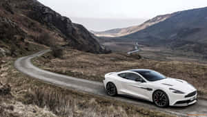 Captivating Aston Martin Vanquish In A Stunning Landscape Wallpaper