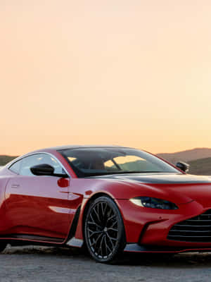 Captivating Aston Martin Vantage In Striking Scenery Wallpaper