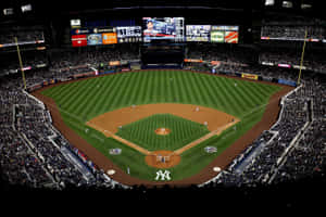 Captivating Baseball Stadium Under The Lights Wallpaper