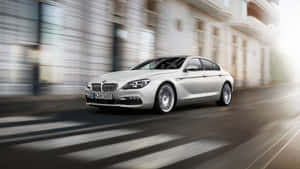 Captivating Bmw 6 Series On The Road Wallpaper