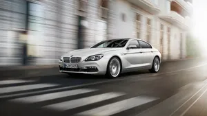 Captivating Bmw 6 Series On The Road Wallpaper