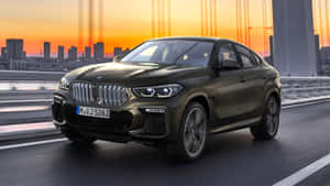 Captivating Bmw X6 With Sleek Design And Powerful Stance Wallpaper